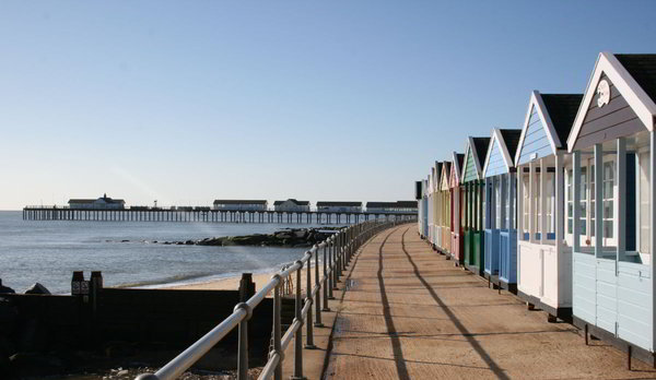 The iconic beach huts with Southwold Pier in the background